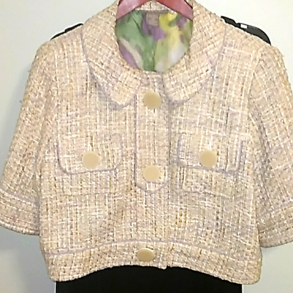 Size L with light spark Jacket color creme.
